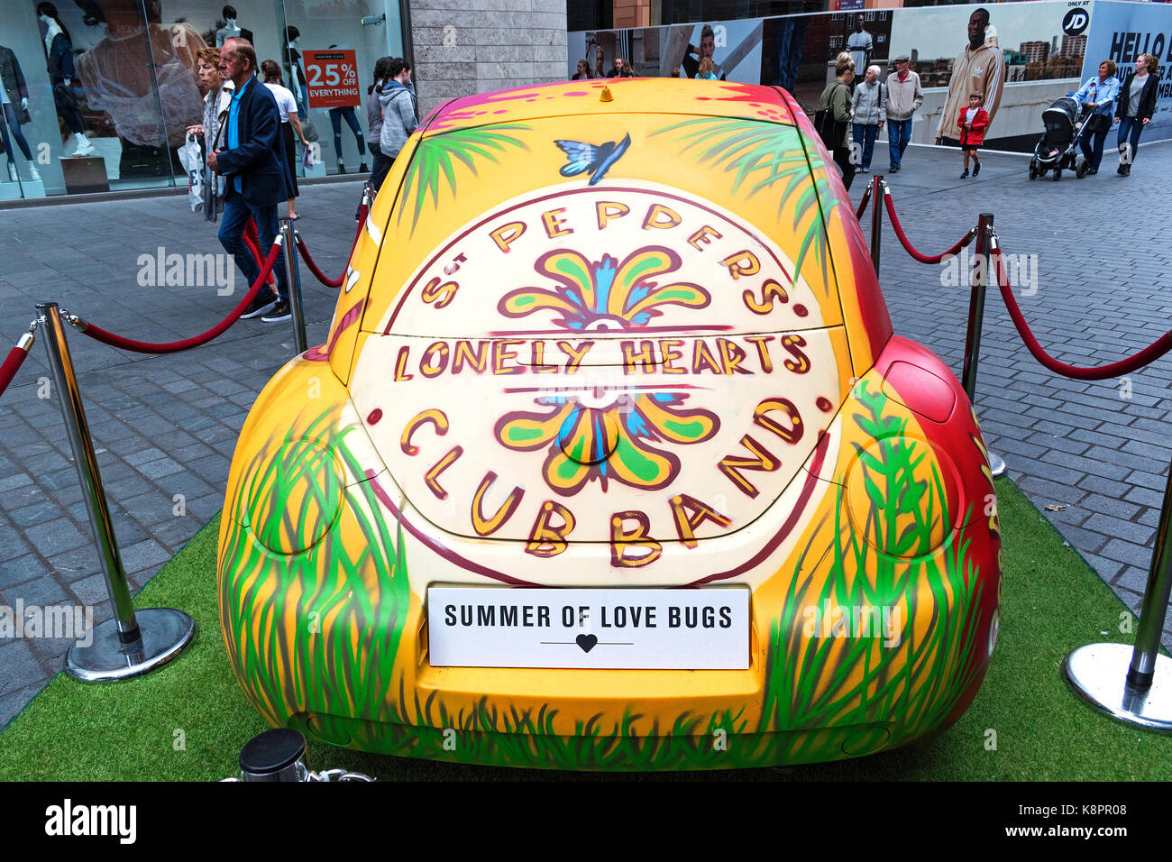 summer of love bugs in liverpool, england, uk, vw beetle painted to celebrate 50 years of the summer of love and the release of the beatles sgt, peppe Stock Photo