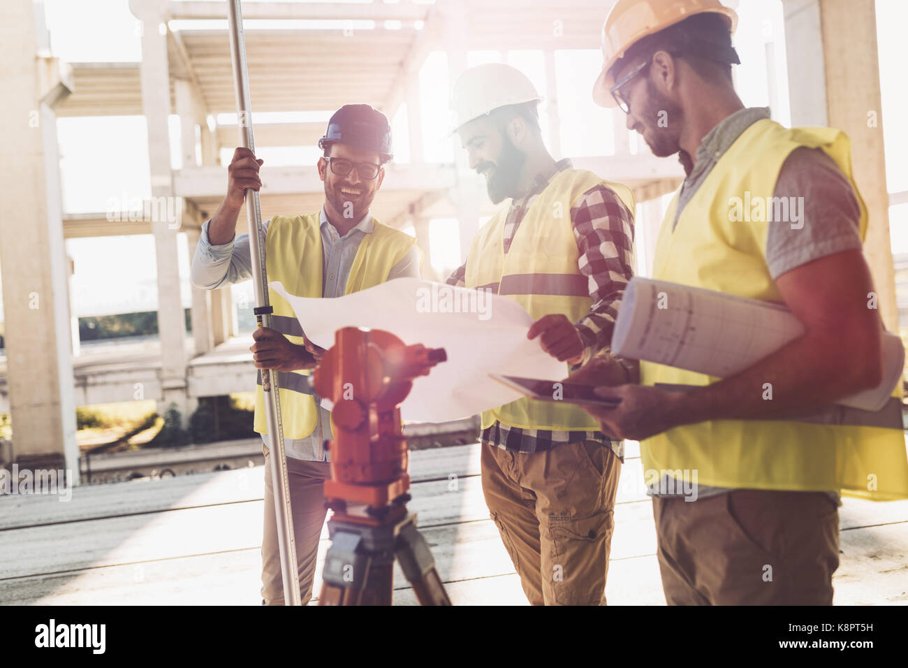 Portrait of construction engineers working on building site Stock Photo ...