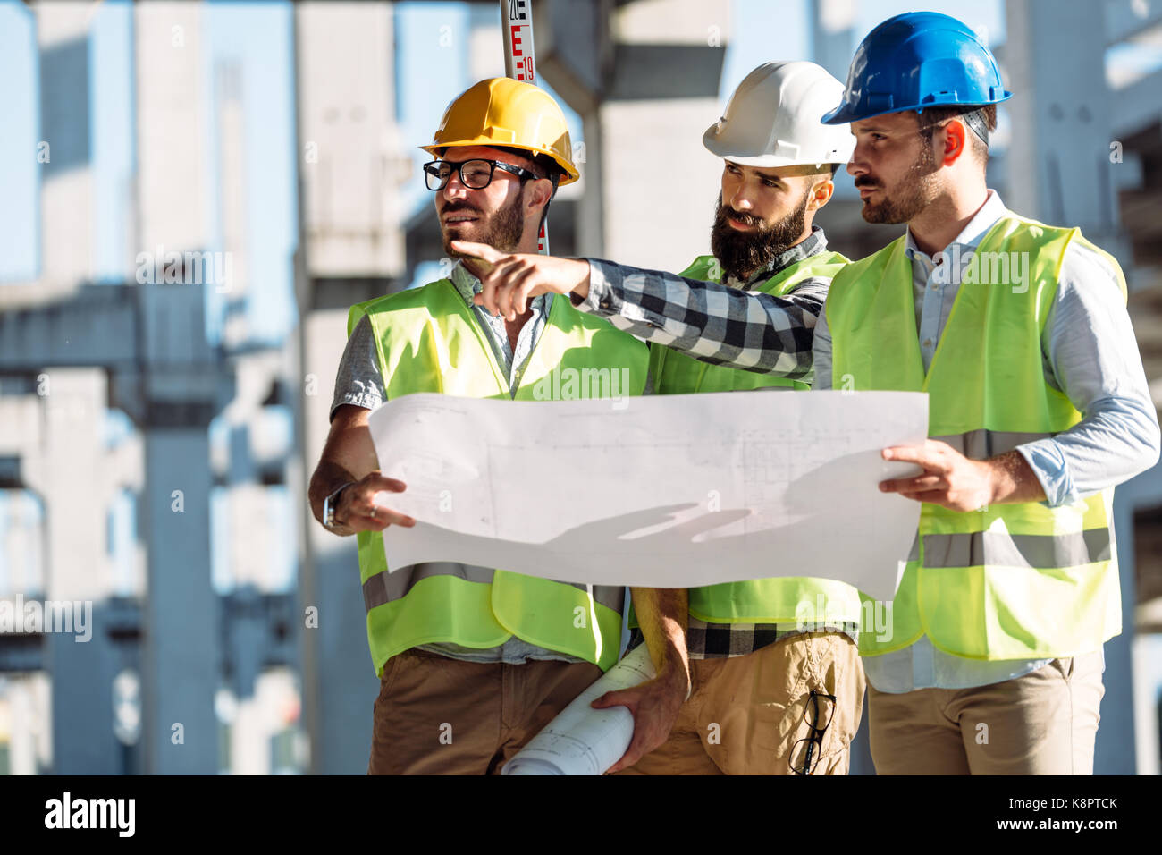 Portrait of construction engineers working on building site Stock Photo