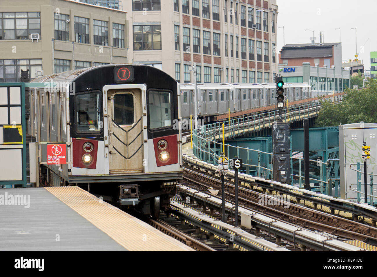 The #7 elevated subway train pulling into the 45th Road-Courthouse Square station in Long Island City Hunter's Point, Queens, New York. Stock Photo