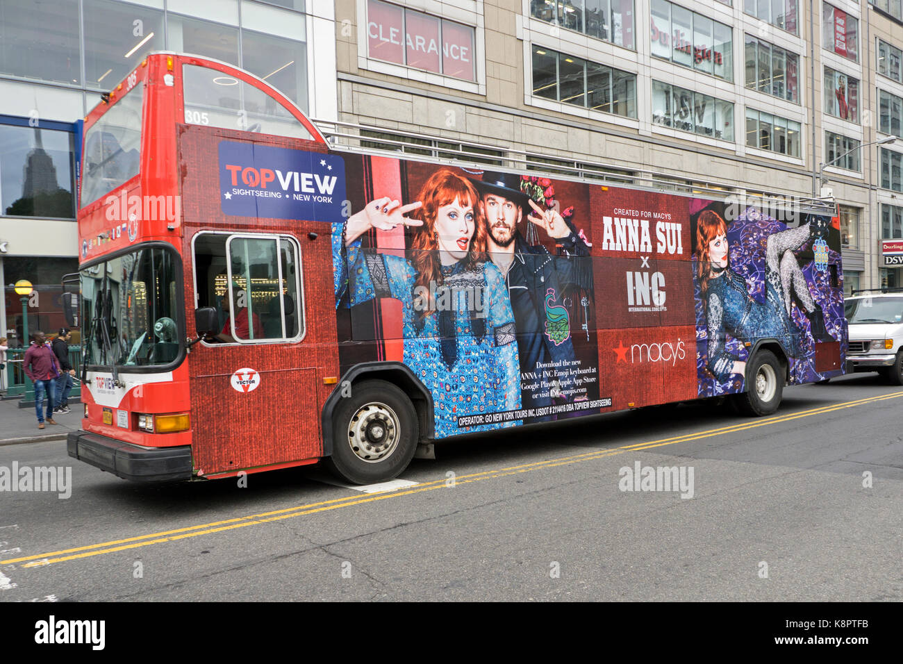 A TopView touring bus with an ornate colorful Anna Sui Macys ad.  Photographed on East 14th Street in Manhattan, New York City. Stock Photo