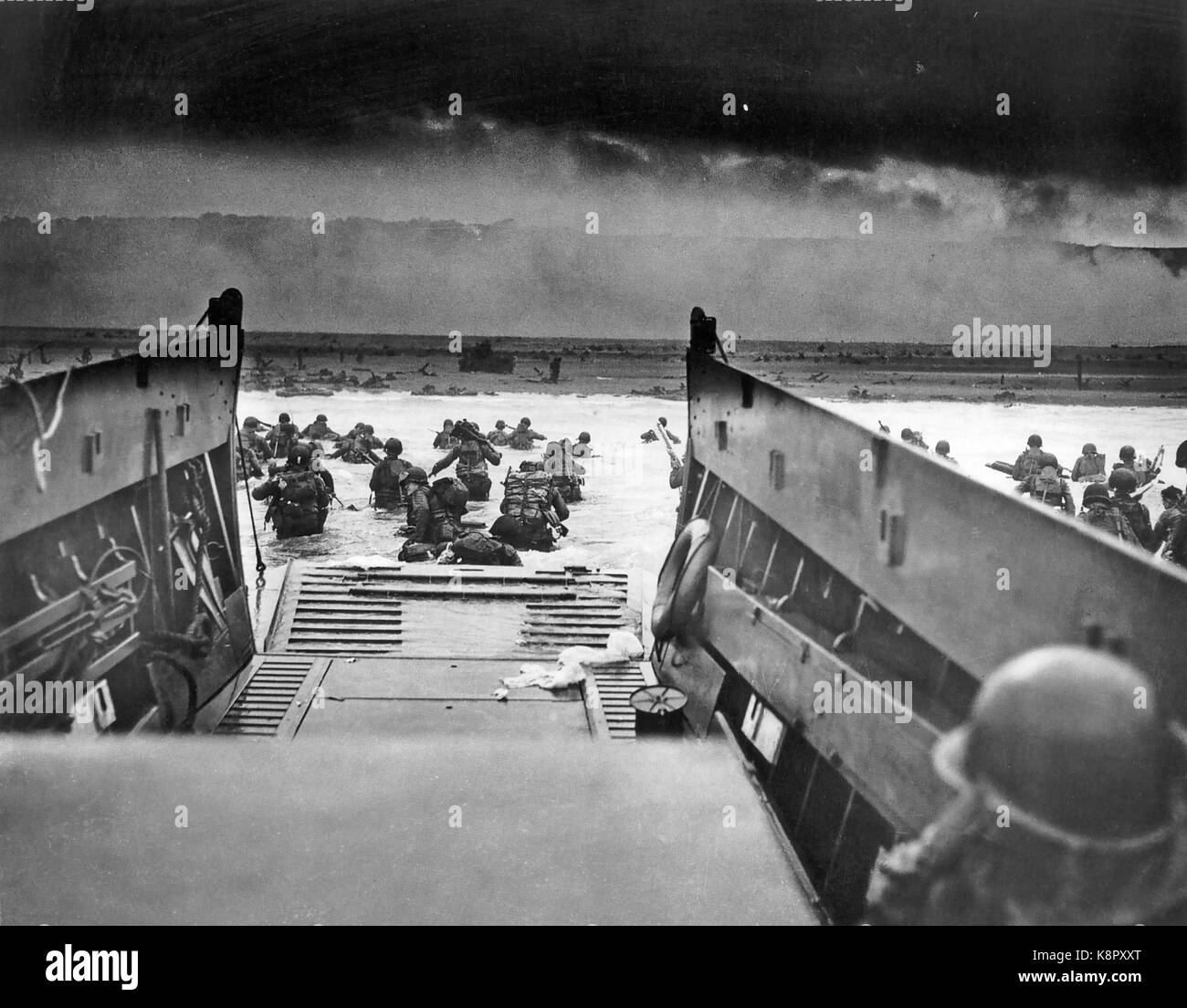 D-DAY  6 June 1944. Robert F. Sargent's photo of Americans from Company E, 16th Infantry, 1st Infantry Division, landing at Omaha Beach seen from the US Coastguard landing craft Samuel Chase. Sargent was a Coast Guard chief petty officer. Stock Photo