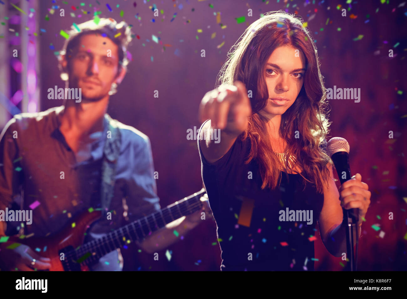 Singer performance standing guitar microphone skill pointing hi-res ...