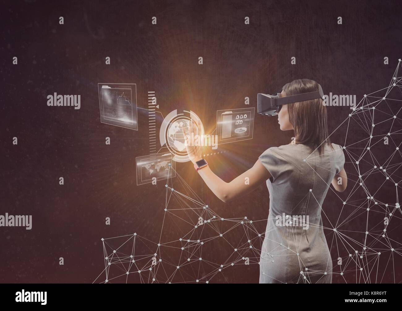 Digital composite of woman in dress using vr headset Stock Photo - Alamy