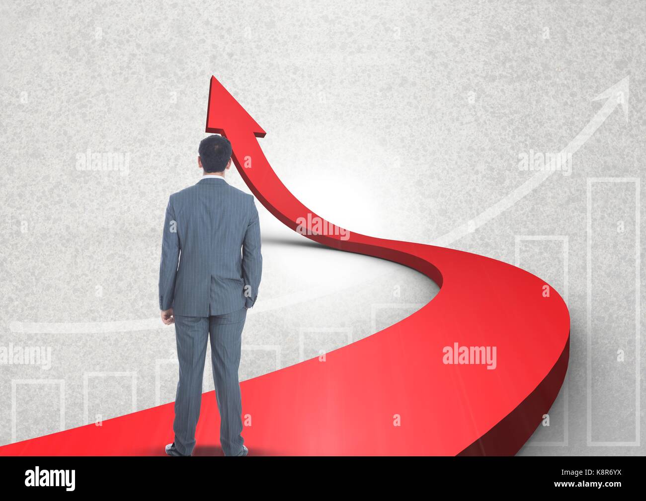 Digital composite of businessman standing on red arrow Stock Photo - Alamy