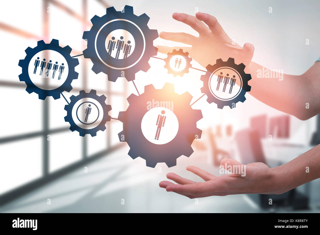 Hands gesturing against white background against computers in empty ...