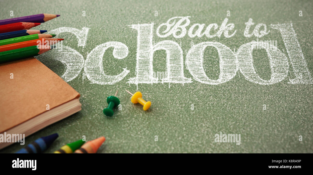 Back to school text against white background against pencils with thumbtacks and book Stock Photo