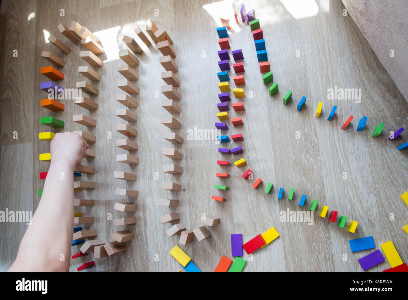 Colorful Domino Blocks in a line on a white background Stock Photo - Alamy