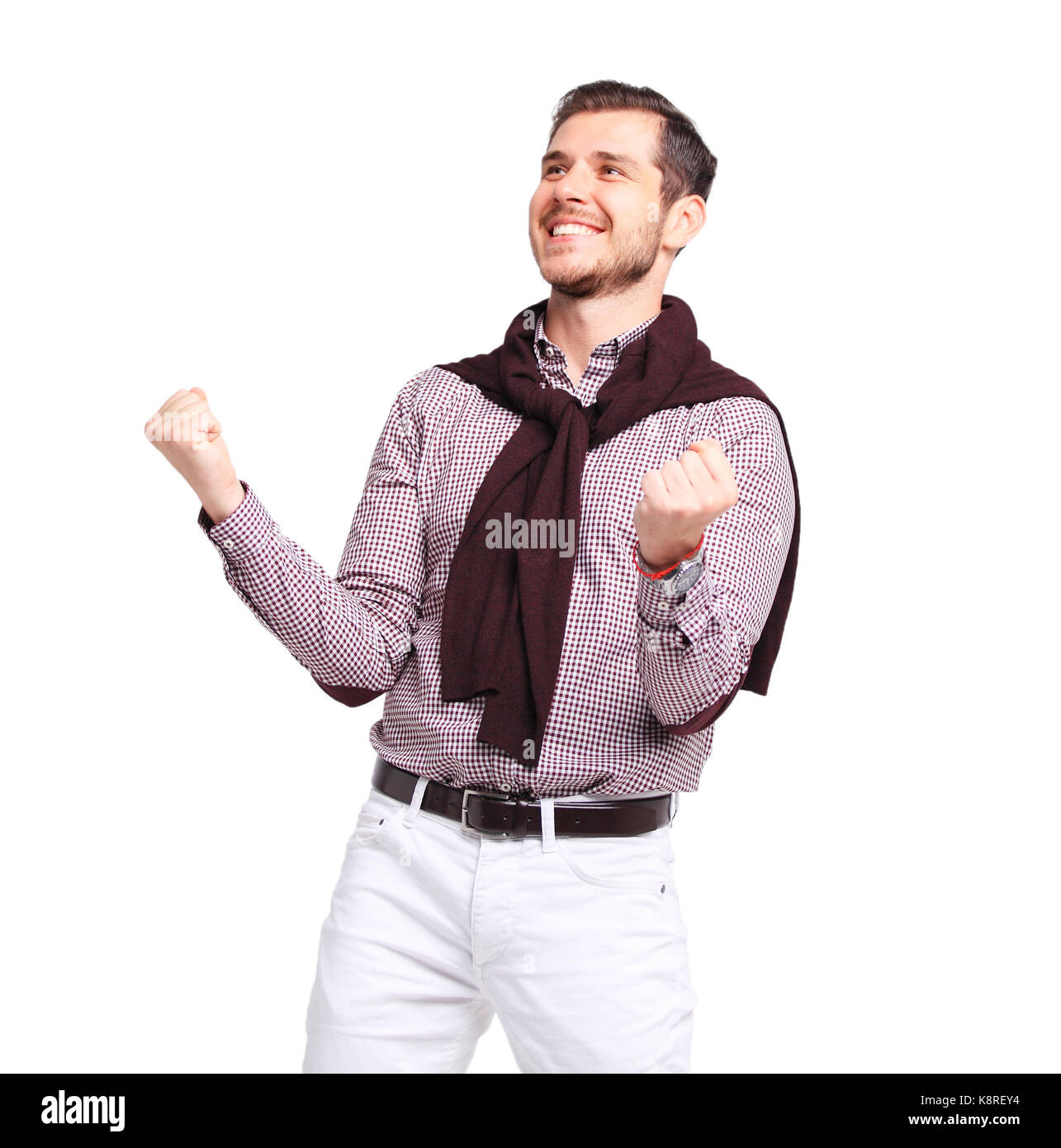 Excited handsome man with arms raised in success - Isolated Stock Photo ...
