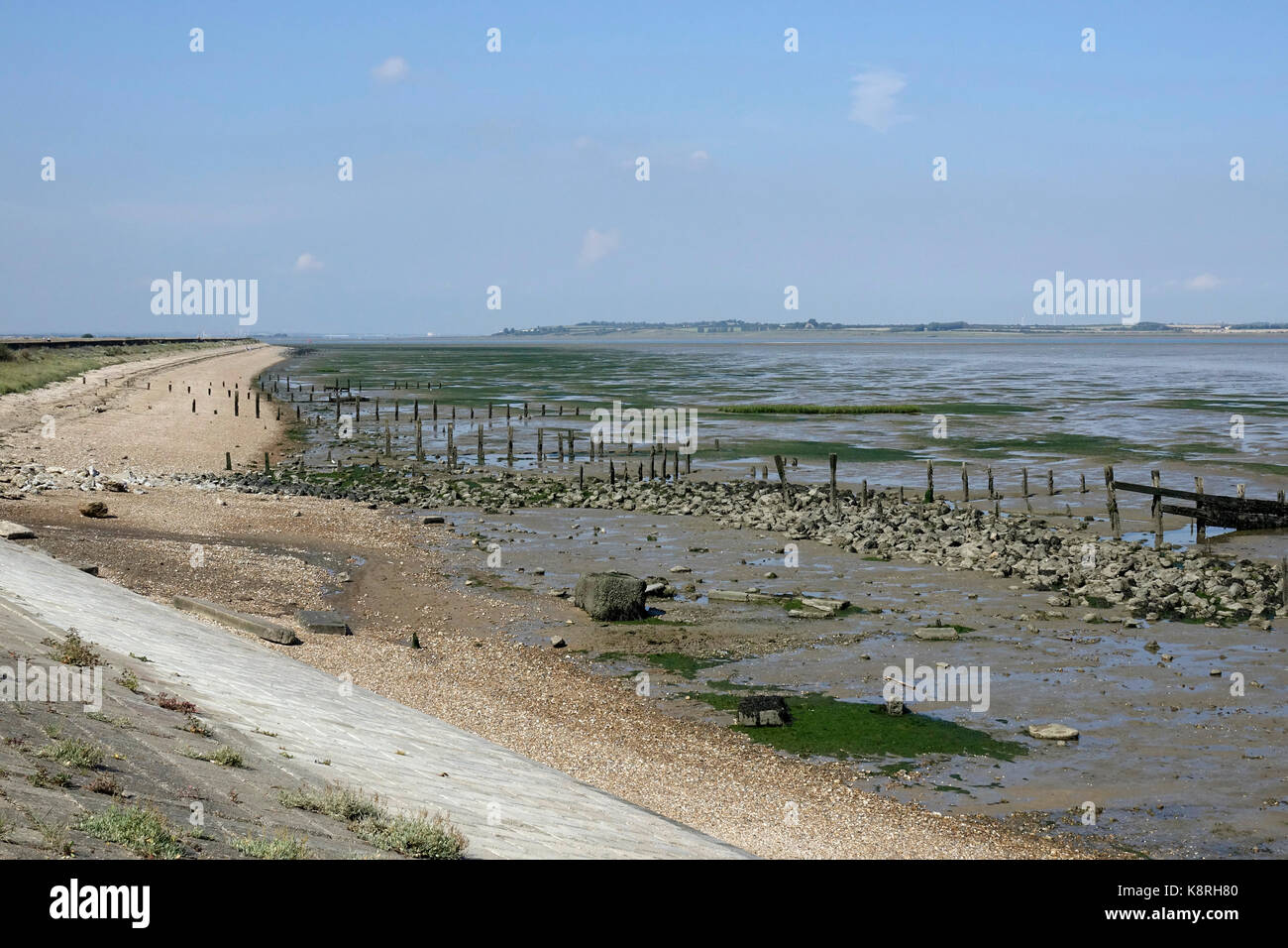 Low tide at South Swale, looking along the sea wall towards the Isle of Sheppy. Kent Wildlife Trust. Stock Photo