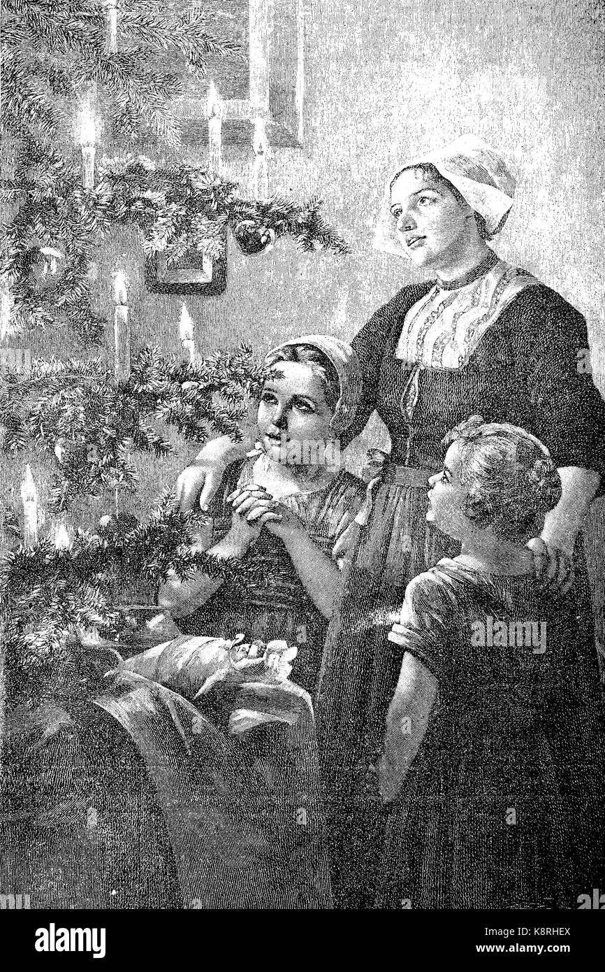 Christmas time, mother and two children in front of Christmas tree with burning candles, Weihnachtszeit, Mutter und zwei Kinder vor dem Weihnachtsbaum mit brennenden Kerzen, digital improved reproduction of a woodcut, published in the 19th century Stock Photo