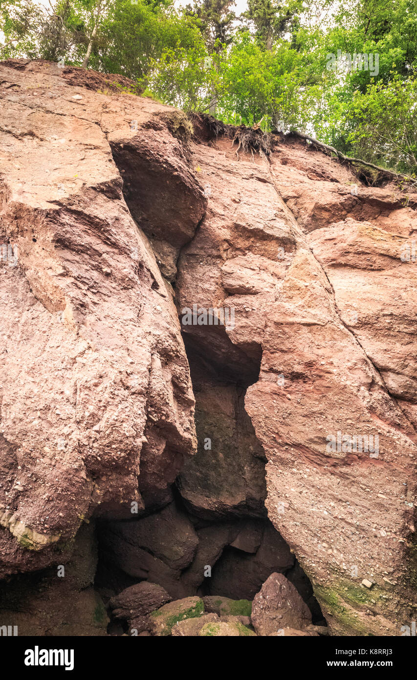 Caves formed as a result of cliff erosion, Hopewell Rocks, Fundy National Park, New Brunswick, Canada Stock Photo