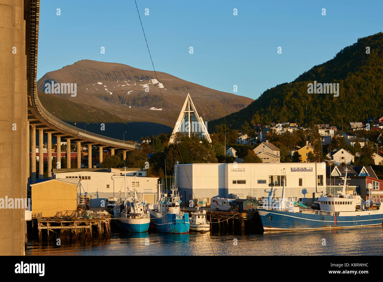 The Norwegian Arctic Cathedral And The Tromso Bridge. Stock Photo