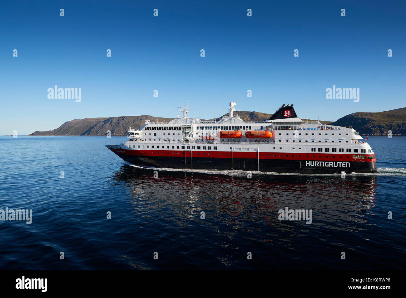 Hurtigruten Ship, MS Polarlys Sailing North, Passing The Norwegian Arctic Island Of Havøya. Stock Photo