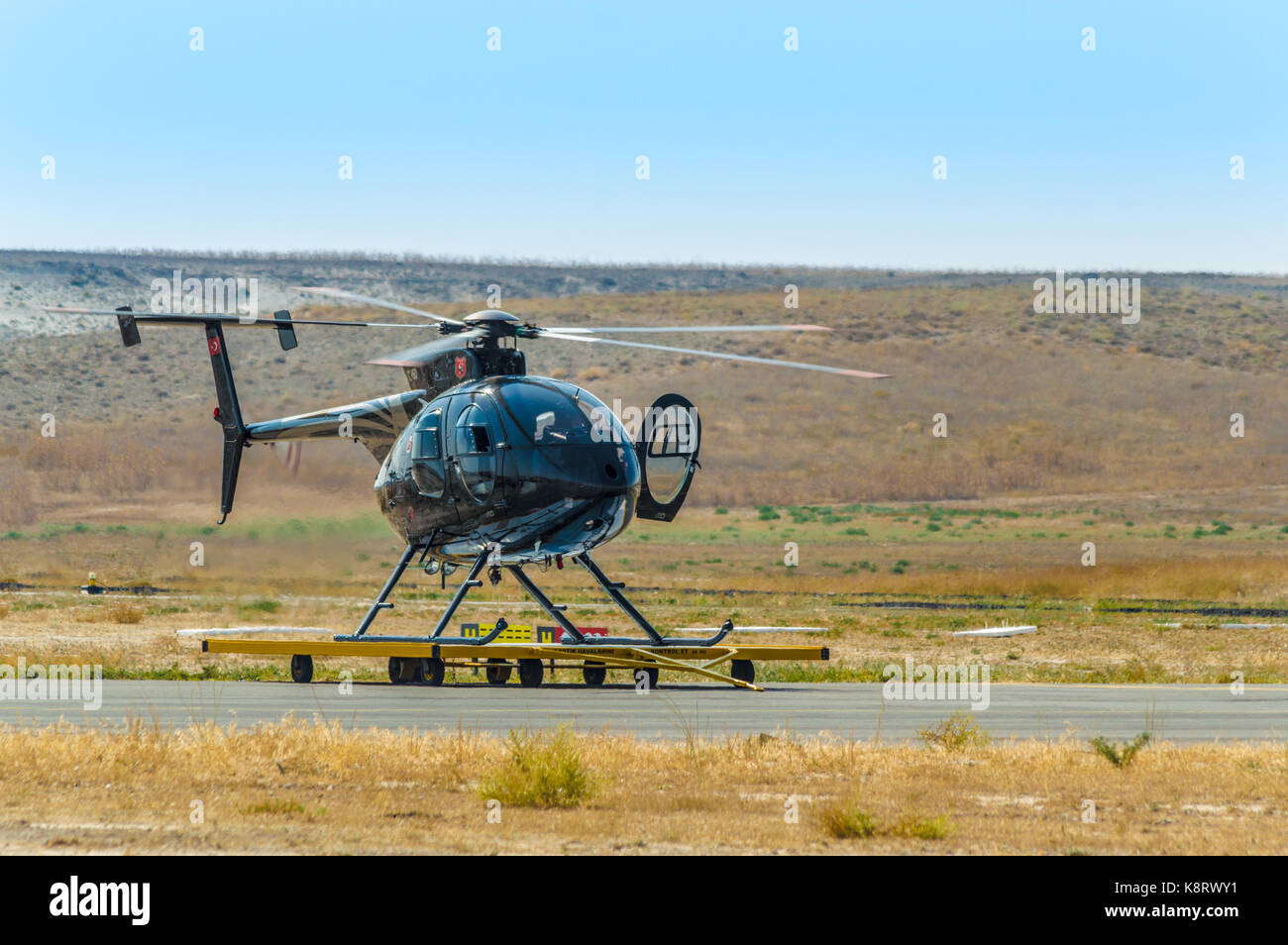 Sivrihisar, Eskisehir, Turkey - September 17, 2017: Sivrihisar Airshows (SHG), small aviation event displayed in SUSHM. The MD 500E helicopter landed  Stock Photo