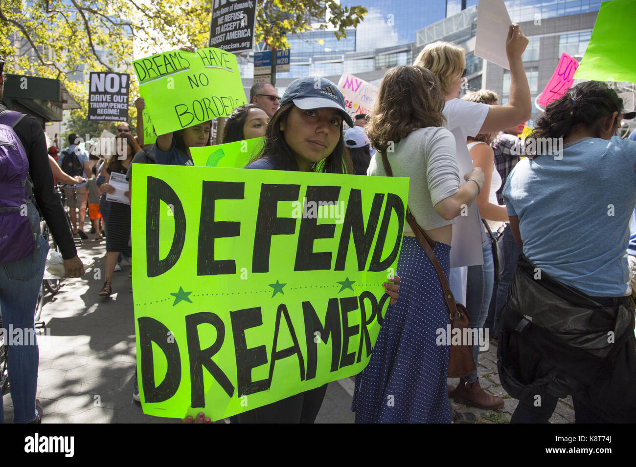 A large demonstration takes place against the Trump Administration's repeal of DACA (The Dreamers Act) at Columbus Circle by the Trump Hotel in New York City. Stock Photo