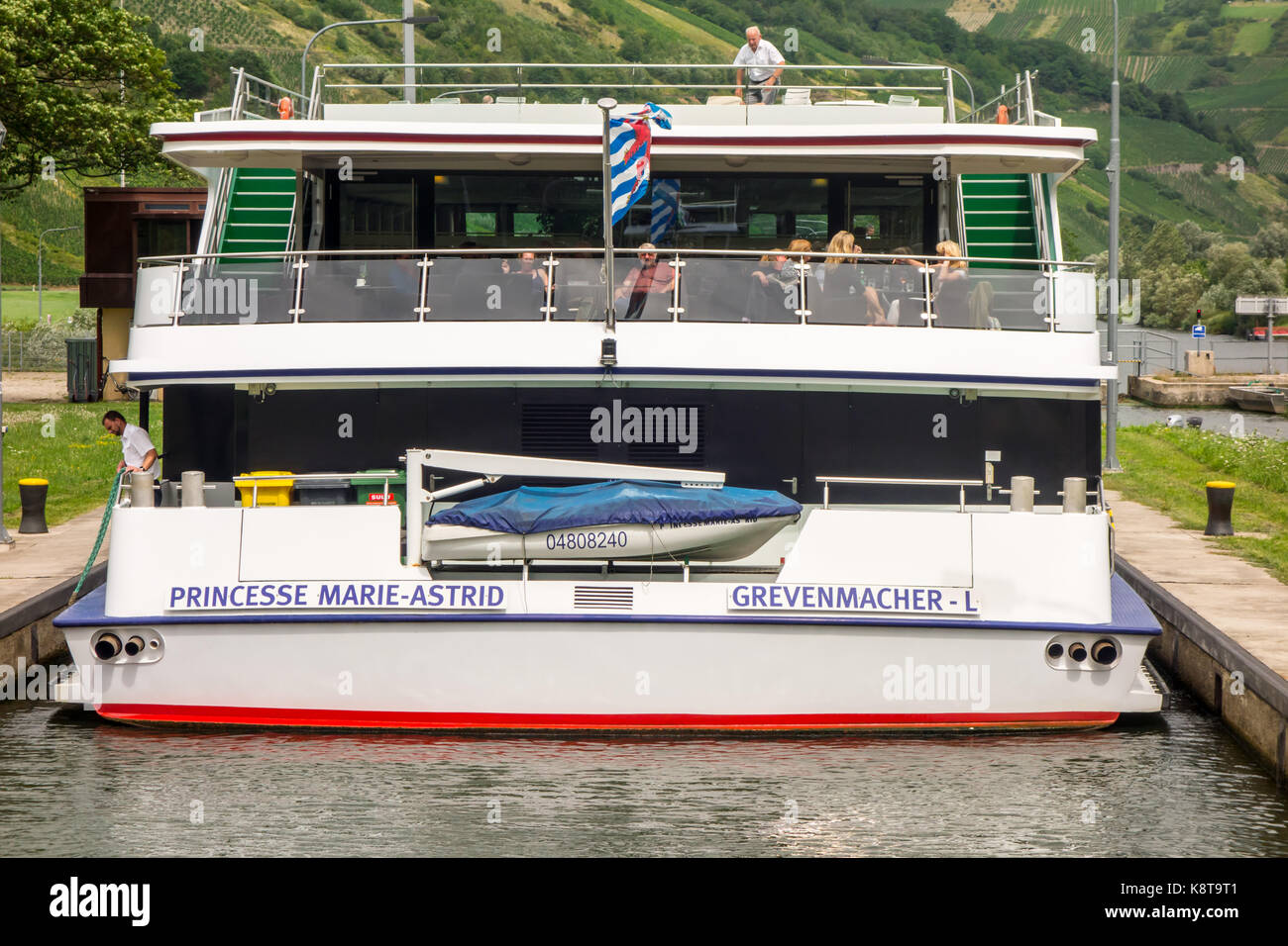 TRIER, GERMANY - 5TH Aug 17:  Passengers relaxes on the Princesse Marie-Astrid cruise as it passes through the second lock of the Moselle in Detzem. Stock Photo