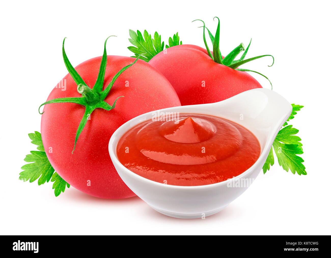 Ketchup in bowl and two fresh tomatoes isolated on white background Stock Photo