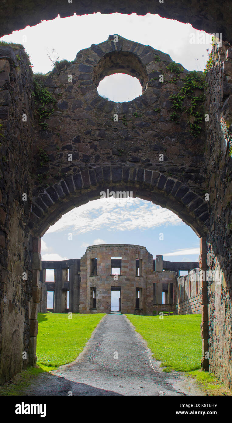 A view through the arched courtyard gates of the Bishop's Mussenden House on the Downhill Demesne near Castlerock in Northern Ireland Stock Photo