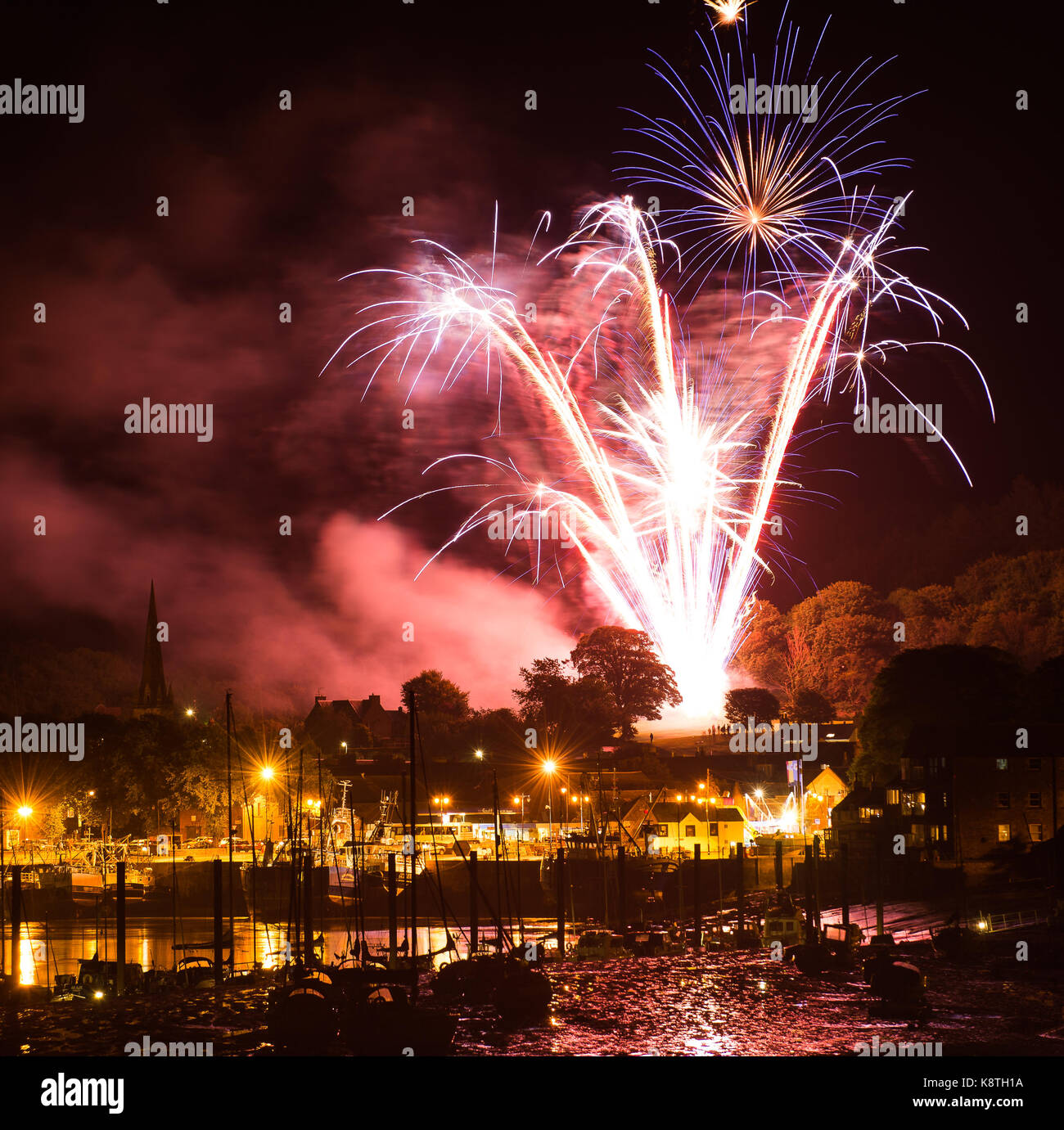 Kirkcudbright, Tattoo, Fireworks, Display, 2017,Boats, Harbour, Star bursts, mudflats, Church, red colour, Harbour Lights, Galloway, Scotland Stock Photo