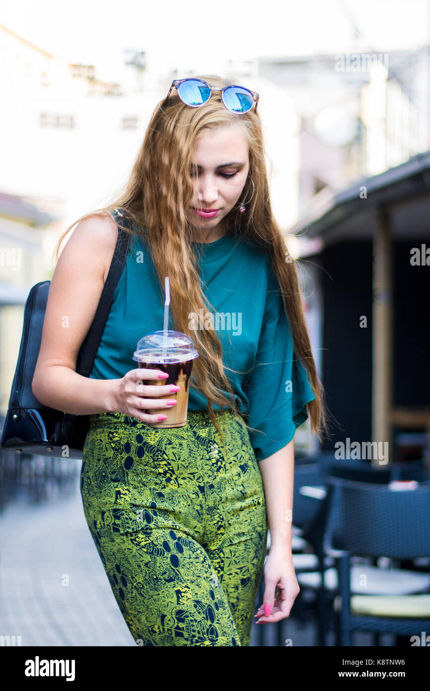 Urban girl with coffee to go on the street Stock Photo