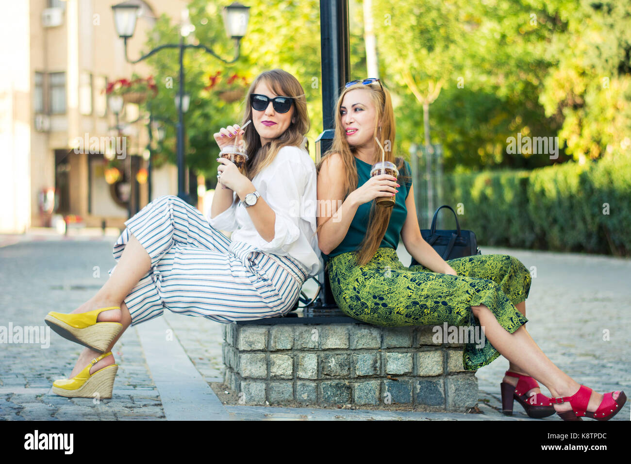 Two girl friends enjoying the day together outdoors Stock Photo