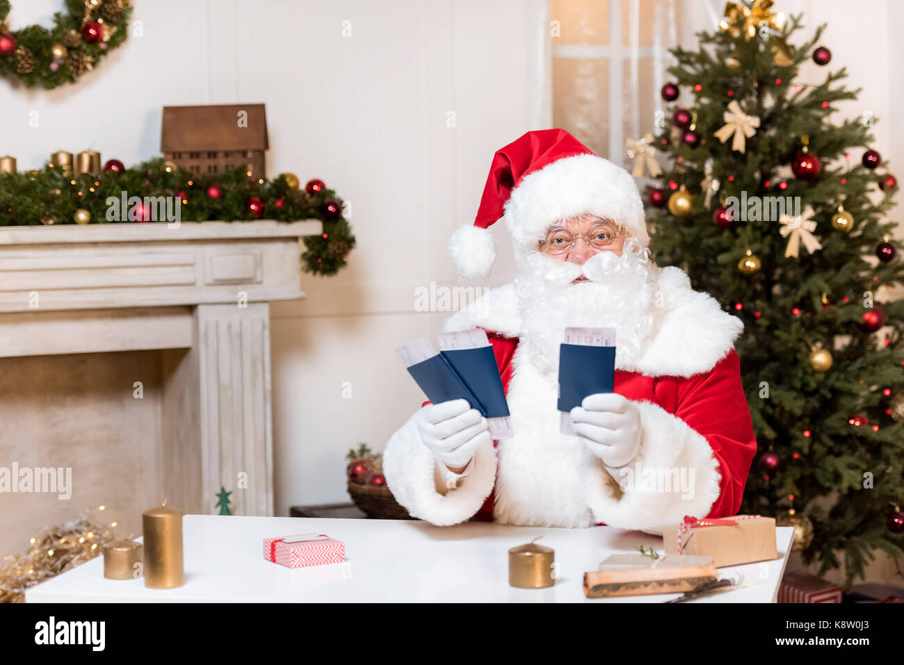 santa claus with tickets and passports Stock Photo Alamy