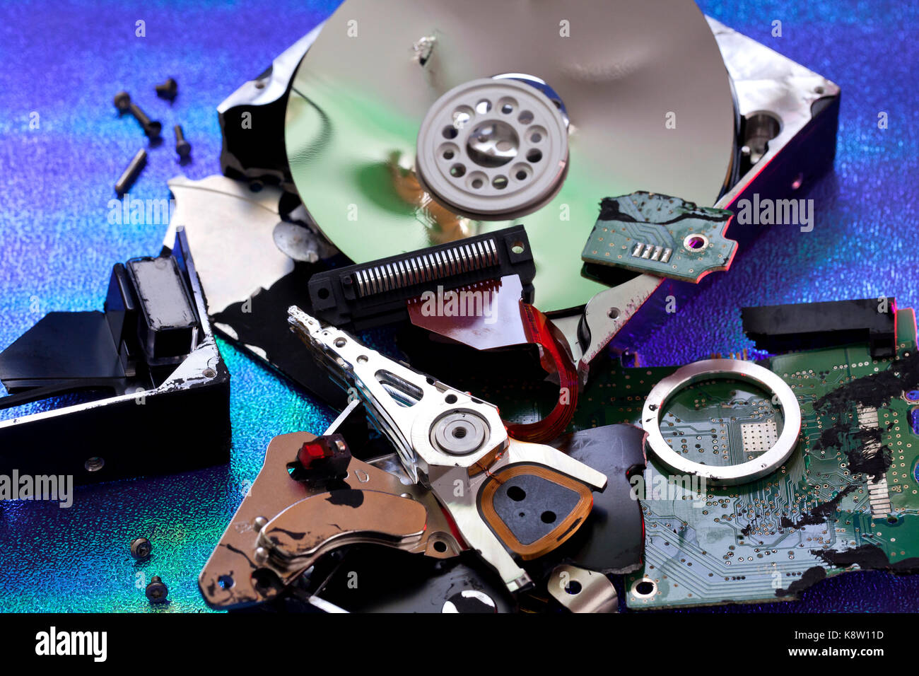 Parts of destroyed computer hard disk drive (HDD exploded view, HDD destroy) - USA Stock Photo