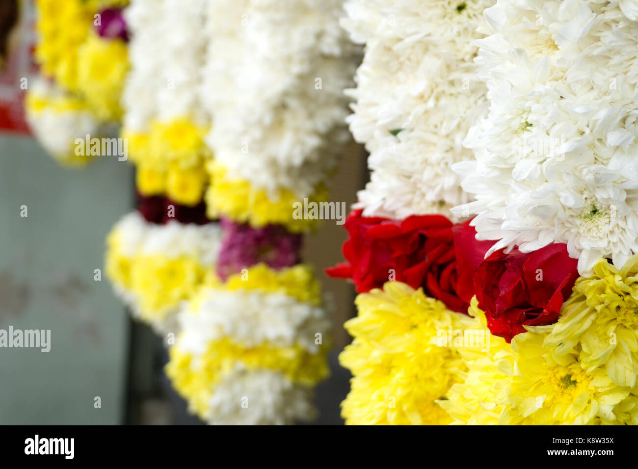 Colorful flower garlands on display in a shop in Little India, Ipoh