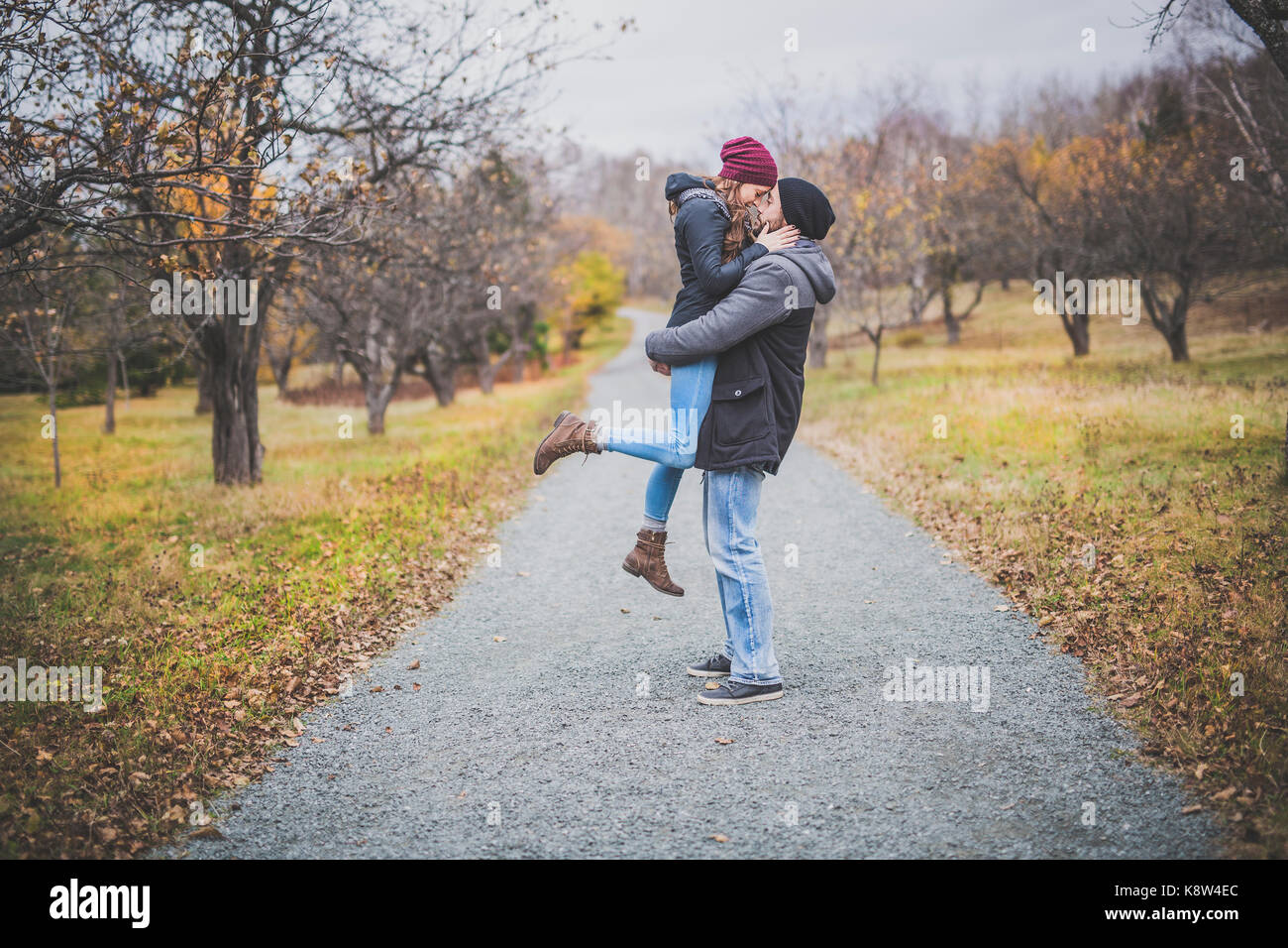 Couple in the autumn park Stock Photo - Alamy