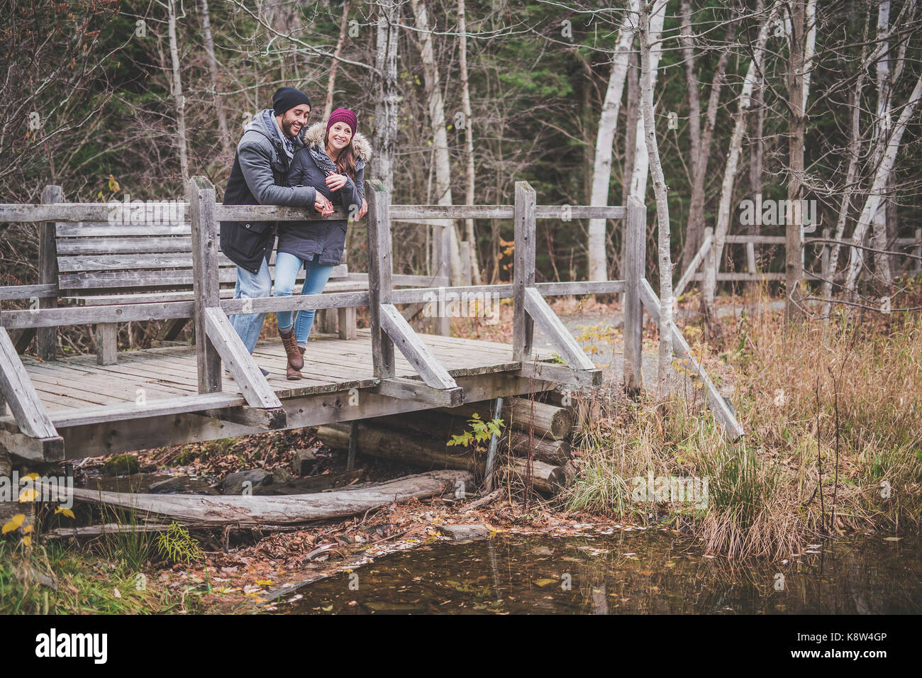 Couple in the autumn park Stock Photo - Alamy