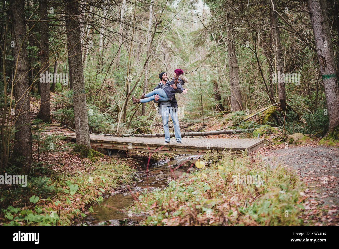Couple in the autumn park Stock Photo - Alamy