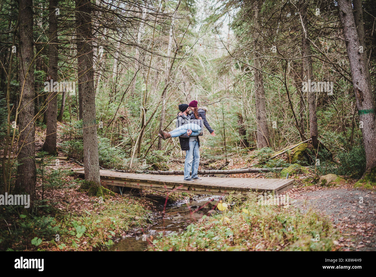 Couple in the autumn park Stock Photo - Alamy