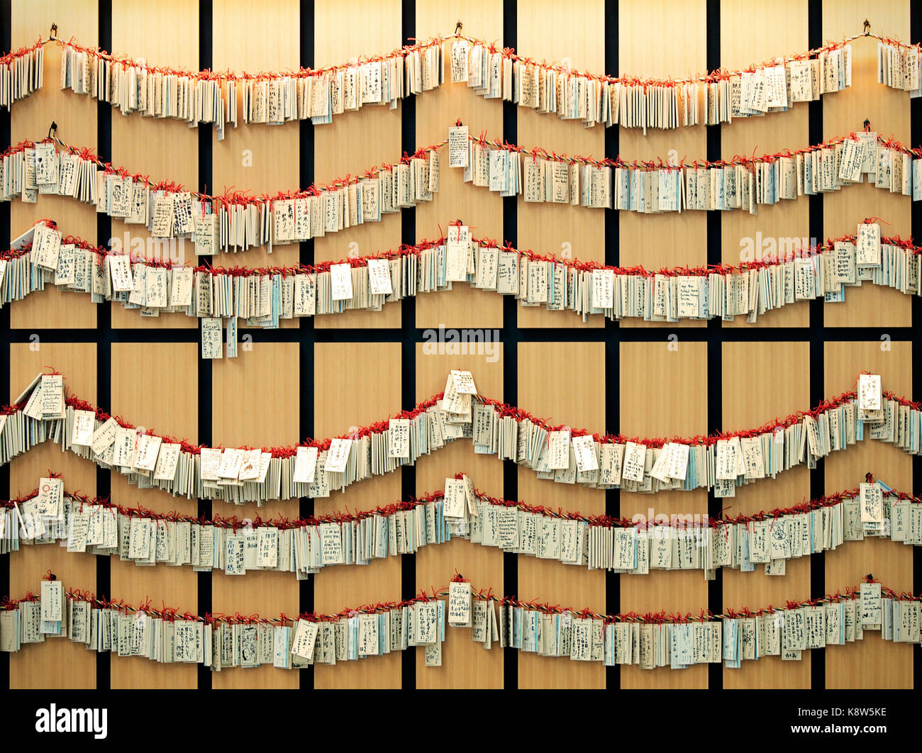 Strings of Wooden Shinto Ema hanging at New Chitose Airport, Hokkaido, Japan Stock Photo