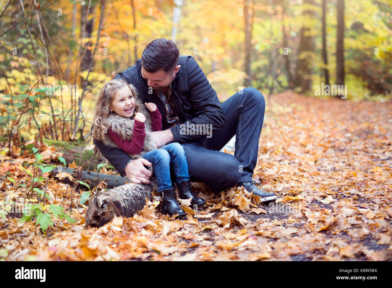 Little adorable girl with happy father in autumn park outdoors Stock ...