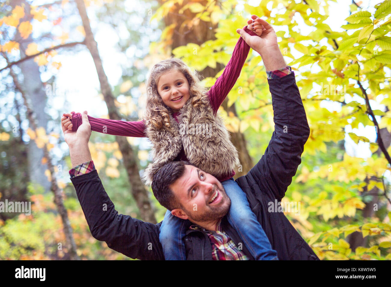 Little adorable girl with happy father in autumn park outdoors Stock ...
