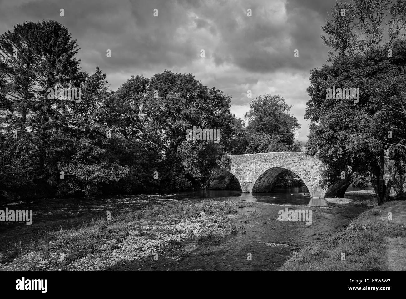 View of the Bridge over the River Exe, Exebridge, a village on the border of Devon and Somerset, England at the confluence of the Barle and Exe rivers Stock Photo