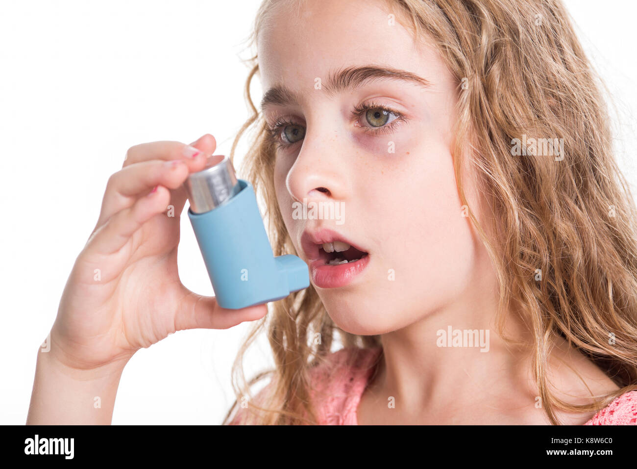 child using inhaler for asthma. White background Stock Photo Alamy
