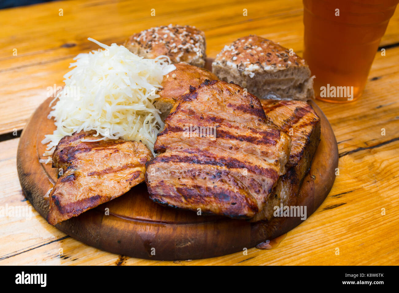Grilled pork meat with beer, garlic dip, sour cabbage Stock Photo Alamy