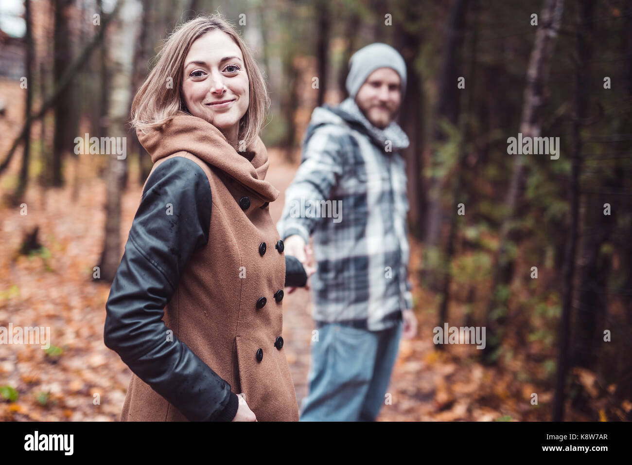 Couple in the autumn park Stock Photo - Alamy