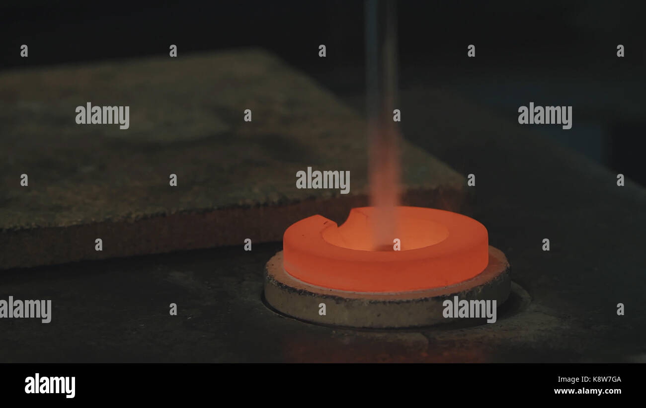 Molten Gold being poured into Ingot moulds. Molten Gold being poured