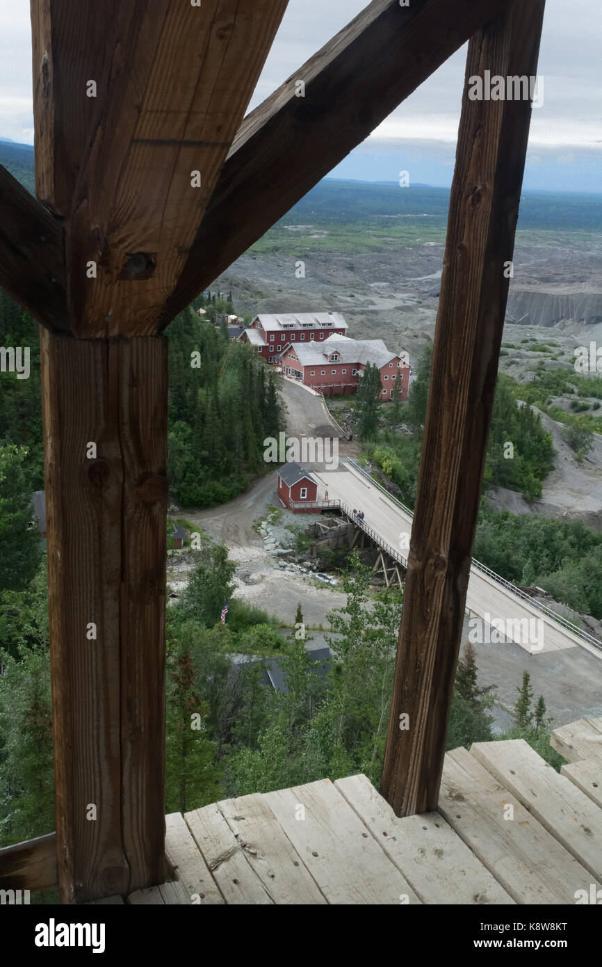 The roadway, which was the former rail bed, stretching pass the old post office at the Kennicott Mine as seen from the top of the sorting building. Stock Photo