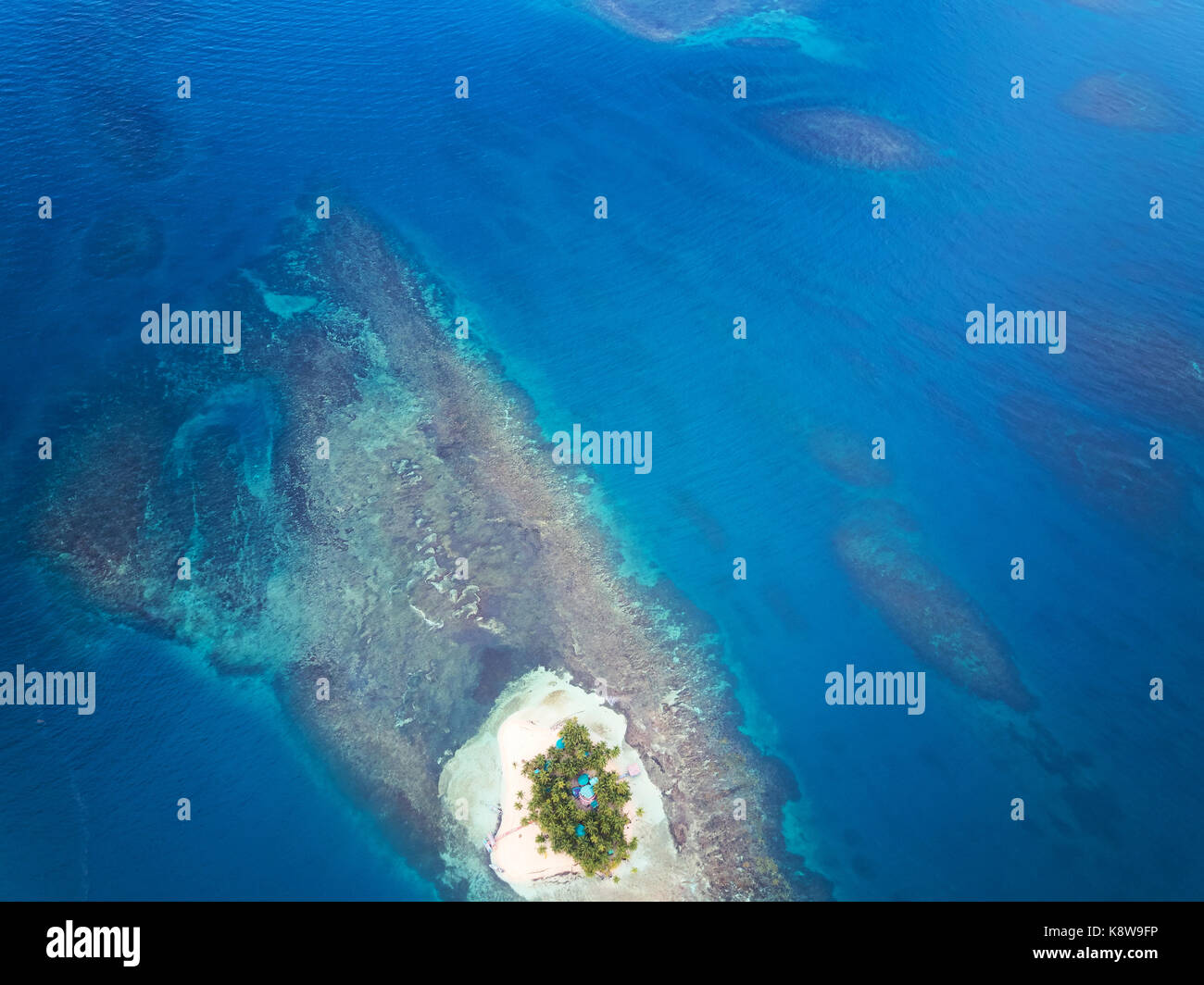 Small island at pattern sea aerial above view Stock Photo