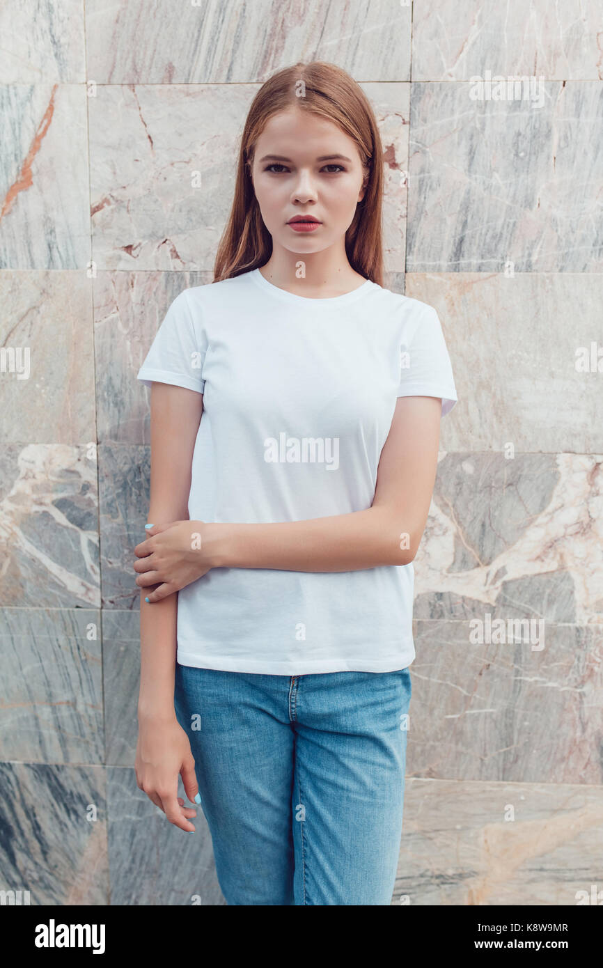 Beautiful blonde girl in white t-shirt. Mock-up Stock Photo - Alamy