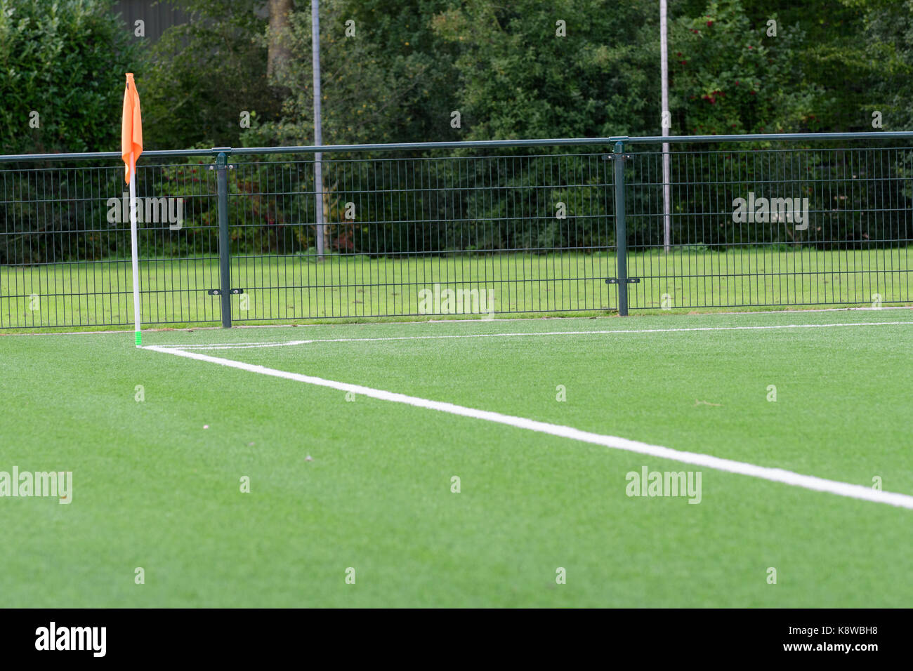 sideline and corner flag and baseline of an artificial grass soccer field Stock Photo