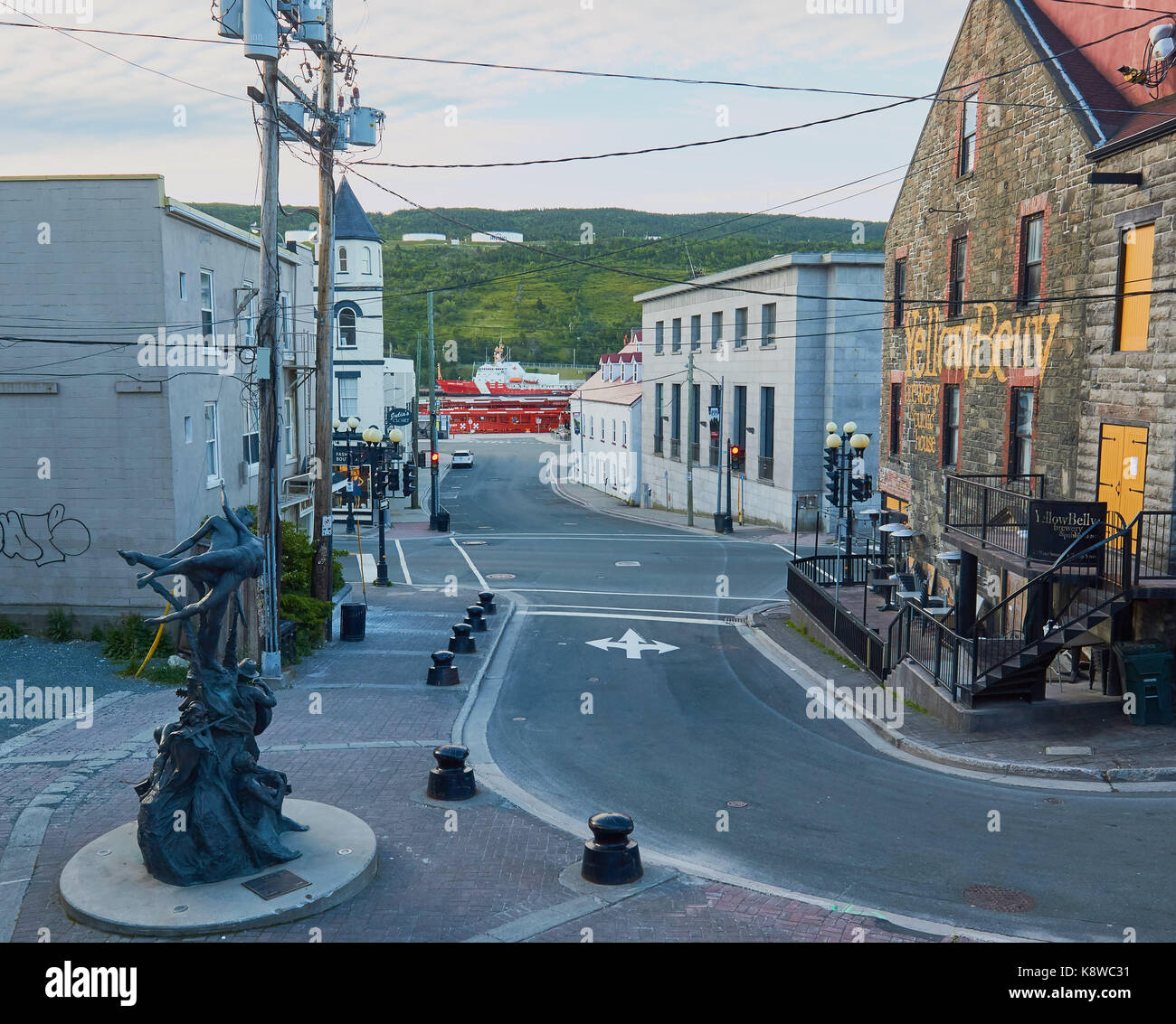 A Time, 2008 bronze sculpture by Morgan MacDonald and the Yellow Belly Brewery and pub, St John's, Newfoundland, Canada Stock Photo