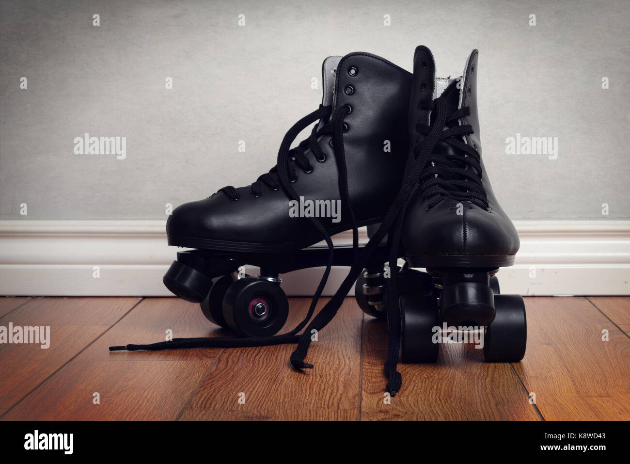 mens roller skates on hardwood floor Stock Photo Alamy