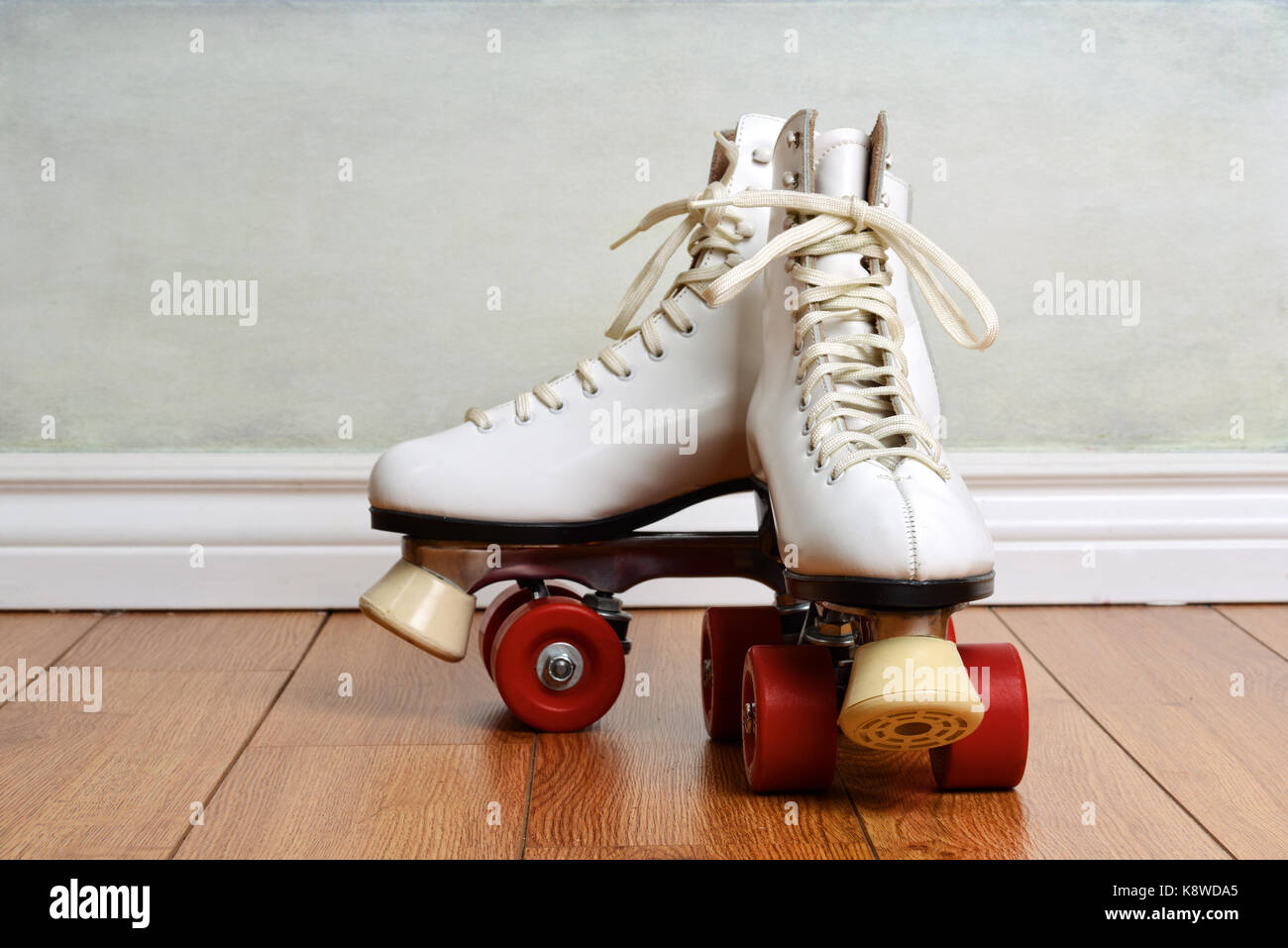women white quad roller skates on wood floor Stock Photo Alamy