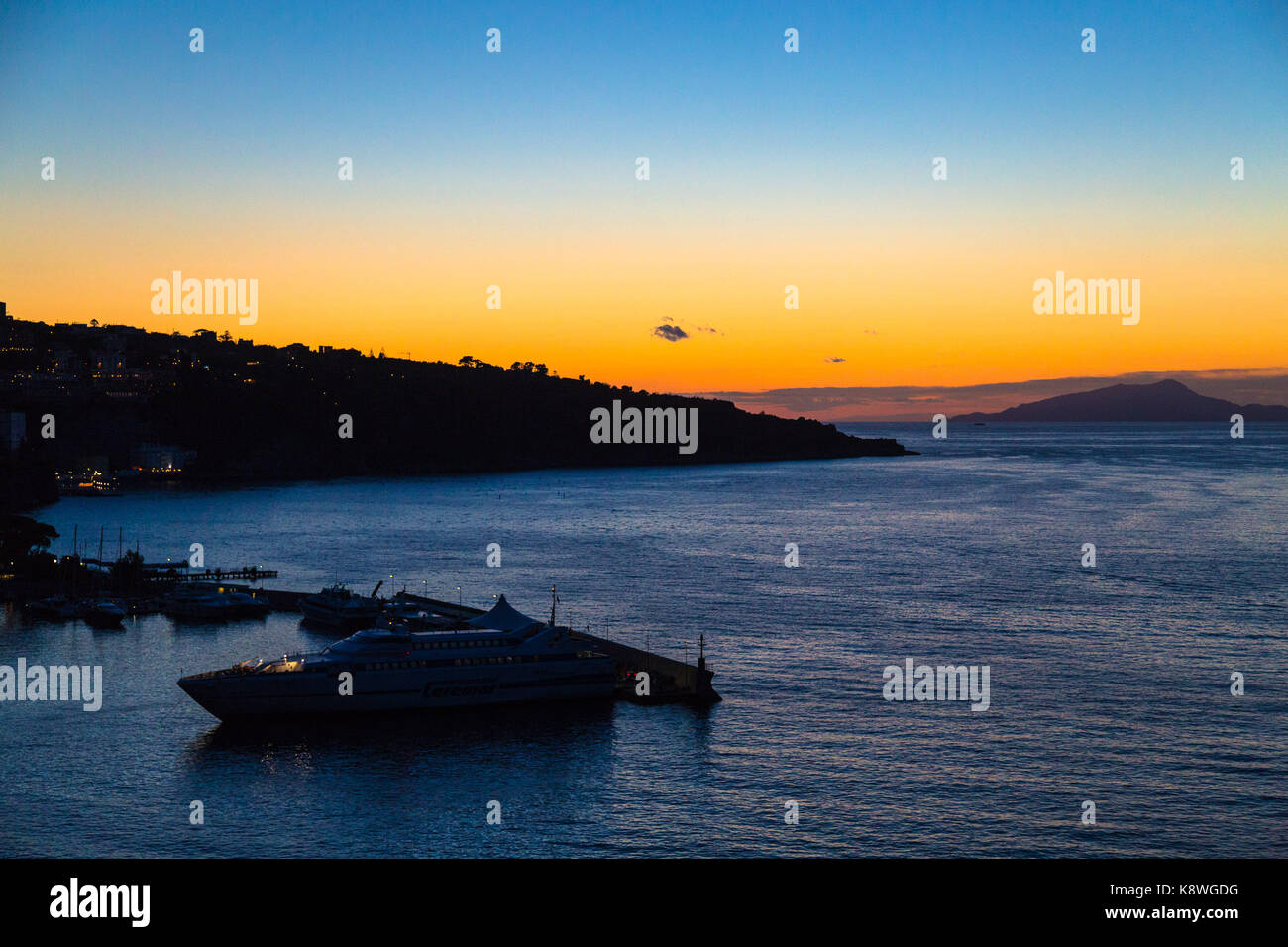 Sorrento, Italy, September 18 2017. The afterglow of sunset creates a restful scene as a ferry