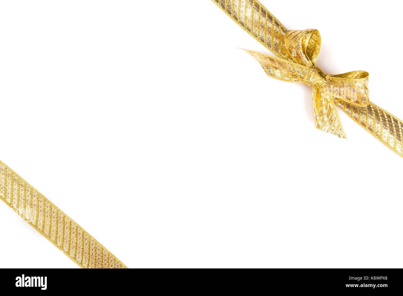 Gold bow isolated on white background. Studio shot Stock Photo - Alamy